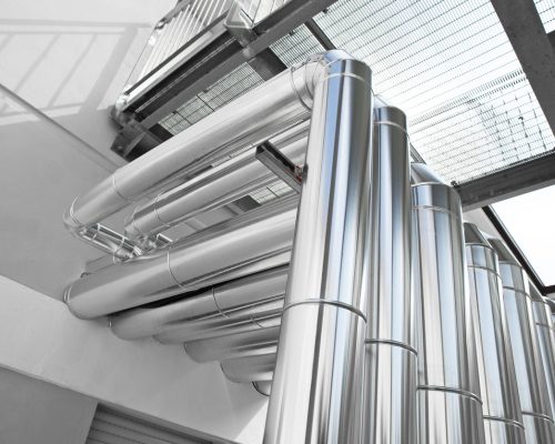 Hvac pipes, heating, ventilation, air conditioning and cooling system, ventilation system ducted through the wall located outside. Climate system for room comfort of building Hvac pipes, heating, ventilation, air conditioning and cooling system, ventilation system ducted through the wall located outside. Climate system for room comfort of building